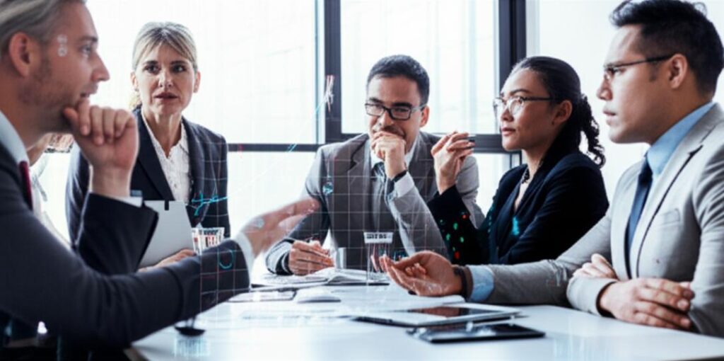 Những Sai Lầm Trong Đàm Phán Phổ Biến và Cách Khắc Phục Hiệu Quả 9 Chuyên gia kinh doanh tham gia cuộc họp đàm phán, với yếu tố công nghệ và phân tích dữ liệu.