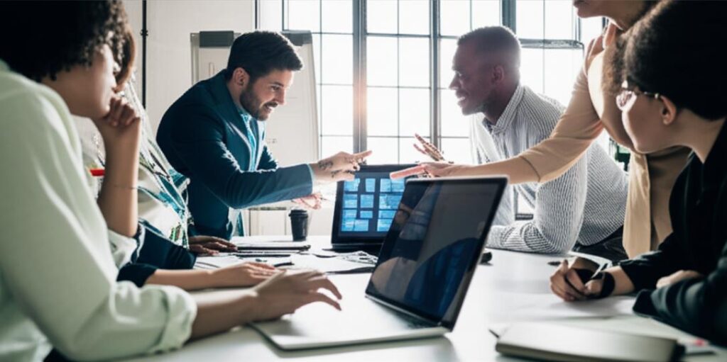 Employees in a collaborative performance review meeting.